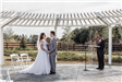 Bride and Groom Under Pergola