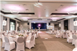 Fully Set up Grand Ballroom with Stage and Tables